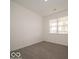 A light-filled bedroom with a large window offers a peaceful retreat at 2254 Oakmont Dr, Plainfield, IN 46168