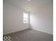 Bright bedroom featuring neutral carpet, white walls, and a window offering ample natural light at 2254 Oakmont Dr, Plainfield, IN 46168