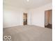 Bright carpeted bedroom with two doorways and natural light at 2254 Oakmont Dr, Plainfield, IN 46168