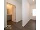 The hallway features an entry door, and an adjacent powder room for convenience at 2254 Oakmont Dr, Plainfield, IN 46168