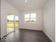Bright living room has sliding glass door with backyard view and a large window at 2254 Oakmont Dr, Plainfield, IN 46168