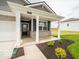 Inviting covered porch framed by classic columns and landscaping at 2254 Oakmont Dr, Plainfield, IN 46168