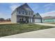 Attractive two-story home with a 2-car garage, manicured lawn, and a modern design at 2260 Oakmont Dr, Plainfield, IN 46168