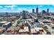 Urban Indianapolis aerial showcasing a brick apartment building with nearby commercial and residential structures at 230 E 9Th St # Apt 405, Indianapolis, IN 46204