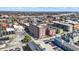 A brick apartment building in a dense urban area with nearby parking, residential buildings, and businesses at 230 E 9Th St # Apt 405, Indianapolis, IN 46204