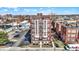 Charming brick building features detailed window bays and a well-maintained parking area for residents and visitors at 230 E 9Th St # Apt 405, Indianapolis, IN 46204