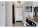 Apartment entryway with a minimalist design with a coat rack and kitchen access at 230 E 9Th St # Apt 405, Indianapolis, IN 46204
