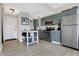 Modern apartment kitchen featuring stainless steel appliances and stylish cabinetry at 230 E 9Th St # Apt 405, Indianapolis, IN 46204