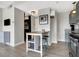 Apartment eat-in kitchen with stainless appliances, a small island, and modern decor at 230 E 9Th St # Apt 405, Indianapolis, IN 46204
