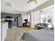 Inviting living space featuring a modern kitchen, bay window, and comfortable living area at 230 E 9Th St # Apt 405, Indianapolis, IN 46204