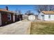 Backyard with a detached garage, shed, and fenced yard at 2317 Courtney Rd, Indianapolis, IN 46219
