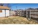 The fenced backyard offers privacy and security, with an included small garden area at 2317 Courtney Rd, Indianapolis, IN 46219