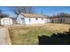 Spacious backyard featuring a detached garage, shed, and fenced perimeter at 2317 Courtney Rd, Indianapolis, IN 46219