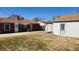 Backyard view of the home and garage with fence at 2317 Courtney Rd, Indianapolis, IN 46219