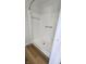 All-white standing shower with wood floors at 2317 Courtney Rd, Indianapolis, IN 46219