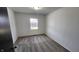 Bedroom with carpet, neutral paint, trim, and one window at 2317 Courtney Rd, Indianapolis, IN 46219