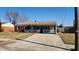 Charming brick ranch-style home with a covered porch, well-kept lawn, and inviting curb appeal at 2317 Courtney Rd, Indianapolis, IN 46219