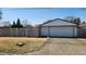 A detached garage is located in the backyard, accessible via the concrete driveway at 2317 Courtney Rd, Indianapolis, IN 46219