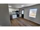 This is a well-lit kitchen with stainless steel appliances and new flooring at 2317 Courtney Rd, Indianapolis, IN 46219