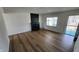 Living room featuring wood flooring, fireplace, and freshly painted white walls at 2317 Courtney Rd, Indianapolis, IN 46219