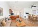 Open-concept living room with hardwood floors connecting to the kitchen and dining areas at 233 E St Joseph St # 3H, Indianapolis, IN 46202