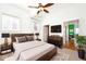 Bedroom with modern furniture, ceiling fan, and a television at 233 E St Joseph St # 3H, Indianapolis, IN 46202