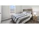 Bedroom with a wood bed frame, window, and light gray carpet at 294 Bent Stream Ln, Brownsburg, IN 46112