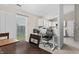 Dining area with a table and chairs, leading to a kitchen with white cabinets at 294 Bent Stream Ln, Brownsburg, IN 46112