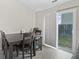 Bright dining area with a sliding glass door leading to the backyard at 294 Bent Stream Ln, Brownsburg, IN 46112
