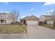 Exterior of a well-maintained single-Gathering home with a two-car garage and a spacious driveway at 294 Bent Stream Ln, Brownsburg, IN 46112
