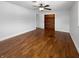Comfortable bedroom with hardwood floors, a ceiling fan, and closet space at 3025 E 6Th St, Anderson, IN 46012