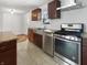 Updated kitchen featuring stainless steel appliances, and granite counters at 3025 E 6Th St, Anderson, IN 46012