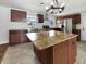 Stylish kitchen with stainless steel appliances, granite countertops, and an eat-in island at 3025 E 6Th St, Anderson, IN 46012