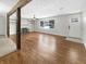 Bright living room featuring a large window, hardwood floors, and a cozy fireplace at 3025 E 6Th St, Anderson, IN 46012