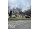 Charming single-story home featuring a well-maintained front yard and a classic facade at 3302 E 42Nd St, Indianapolis, IN 46205