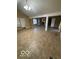 Expansive living room featuring vaulted ceiling, neutral tiled flooring and natural light at 3302 E 42Nd St, Indianapolis, IN 46205