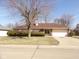 Brick home with manicured lawn and attached garage on a sunny day at 3534 Country Walk Dr, Indianapolis, IN 46227