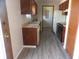 Functional kitchen featuring a laminate countertop, double sink, and modern flooring at 3534 Country Walk Dr, Indianapolis, IN 46227