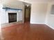 Living room with hardwood floors and brick fireplace at 3534 Country Walk Dr, Indianapolis, IN 46227