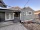 Back exterior with sliding glass doors, a covered patio, and durable siding at 3561 Bowen Pl, Indianapolis, IN 46221