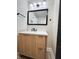Modern bathroom featuring a stylish vanity with a white countertop and sleek black fixtures at 3561 Bowen Pl, Indianapolis, IN 46221