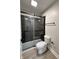 Modern bathroom featuring walk-in shower, glass door, and sleek fixtures at 3561 Bowen Pl, Indianapolis, IN 46221
