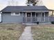 Charming single-story home with a covered front porch and well-maintained lawn at 3561 Bowen Pl, Indianapolis, IN 46221