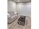 Cozy living room with wood-look floors, a comfortable sofa, and bright natural light at 3561 Bowen Pl, Indianapolis, IN 46221