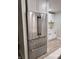 Modern stainless steel refrigerator and white cabinets in a kitchen at 3561 Bowen Pl, Indianapolis, IN 46221