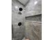 Luxury shower with gray tile, rain head, and recessed niche for toiletries at 3561 Bowen Pl, Indianapolis, IN 46221