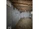 Unfinished basement provides a blank canvas with painted block walls and pipes at 3610 Robson St, Indianapolis, IN 46201