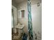 Bathroom featuring a combination shower-tub, toilet, and pedestal sink at 3610 Robson St, Indianapolis, IN 46201