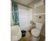 Cozy bathroom with a combination shower-tub, toilet, and pedestal sink at 3610 Robson St, Indianapolis, IN 46201