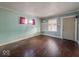 Bedroom featuring hardwood floors, natural light, and a neutral color scheme at 3610 Robson St, Indianapolis, IN 46201